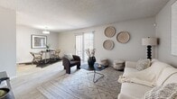 Located at 4337 N 53rd Ln in Phoenix, AZ, this 2-bedroom, 2-bathroom single-floor residence offers a well-organized layout across a comfortably sized floor plan. The open living and dining area serves as the heart of the home, featuring wood-look flooring, a textured ceiling, and a sliding glass door that fills the space with natural light and provides access to an outdoor patio. The kitchen is thoughtfully designed in a galley style with white cabinetry, light stone countertops, and stainless steel appliances including a range, refrigerator, and dishwasher — all set atop easy-care wood-look flooring. Both bedrooms are well-proportioned, with the primary offering generous square footage, a dedicated walk-in closet with built-in shelving, and a window for natural light. The second bedroom also features a window and its own closet. The two bathrooms are clean and functional — one includes a single vanity with white cabinetry and a walk-in shower, while the other features a full tub-shower combo. A connecting hallway ties all rooms together efficiently. Throughout, the neutral color palette and consistent flooring create a cohesive, move-in-ready atmosphere suited to a variety of lifestyles.