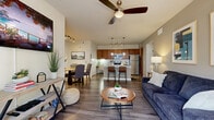 Located at 14200 Vance Jackson Road in San Antonio, TX, this single-story residence offers three bedrooms and three bathrooms within a thoughtfully designed open-concept floor plan. The living, dining, and kitchen areas flow seamlessly together, anchored by rich wood-look flooring and neutral tones throughout. A ceiling fan overhead and large French doors in the living room fill the space with natural light while providing direct access to one of two outdoor patios.

The kitchen is a standout feature, showcasing warm wood cabinetry, a classic subway tile backsplash, stainless steel appliances, and a granite-topped island with bar seating and pendant lighting — ideal for both everyday cooking and entertaining. An adjacent dining area with track lighting offers a dedicated space for meals.

The bedrooms are carpeted for comfort, with the primary bedroom featuring dual windows and a ceiling fan. The bathrooms include tiled tub-shower combinations with cabinetry for storage. Additional practical spaces include a dedicated laundry room with washer and dryer hookups, a hallway, and two closets with wire shelving systems. The layout makes efficient and functional use of every area, delivering a comfortable and cohesive living environment.