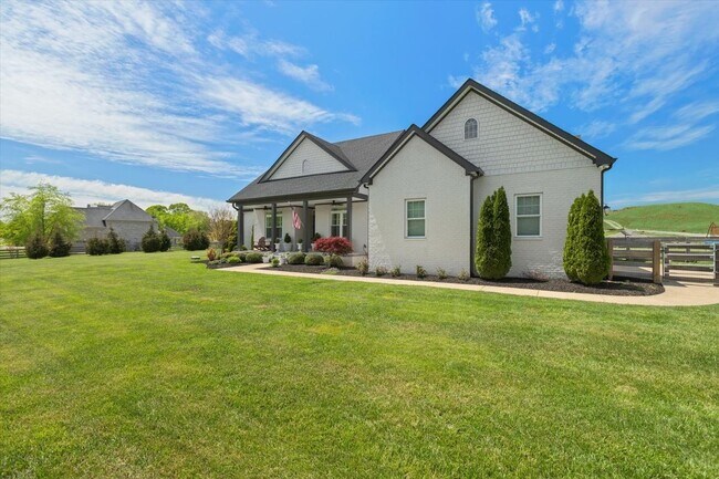 Building Photo - unning custom-built home on a full acre in...