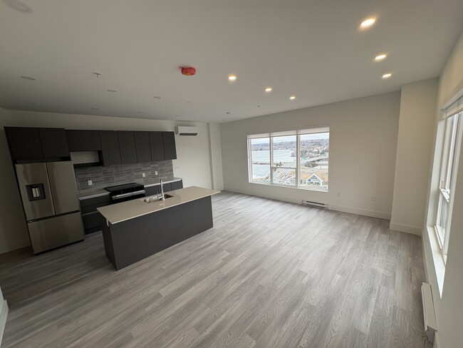 Photo du bâtiment - Beautiful New 1 Bed + Den