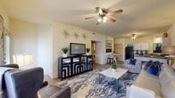 Located at 4101 24th Ave SE in Norman, Oklahoma, this 2-bedroom, 1-bathroom residence offers a thoughtfully designed single-floor layout. The open living room serves as the heart of the home, featuring neutral-toned walls, carpet flooring, a ceiling fan with light fixture, and generous natural light from a large front-facing window. The space flows seamlessly into a dedicated dining area and toward the kitchen.

The kitchen is equipped with white cabinetry, dark granite-style countertops, black appliances including a refrigerator, range with over-the-range microwave, and dishwasher, as well as tile flooring that adds a clean, durable finish.

The spacious primary bedroom includes plush carpet, a ceiling fan, and a double-door closet offering ample storage. The second bedroom also features carpet flooring, a window with natural light, and convenient access to a walk-in closet. Both rooms are well-proportioned and comfortable.

The full bathroom is finished with tile flooring, a single-sink vanity with white countertop, a framed mirror, wall-mounted cabinetry, and a shower-tub combination with sliding glass doors. The overall aesthetic throughout is clean and bright, with warm neutral tones creating a welcoming and functional living environment.