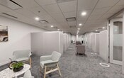 Located at 10023 104 Street NW in downtown Edmonton, Alberta, this professionally designed single-floor office suite offers a well-organized and functional layout tailored for client-facing or consulting-style operations. The space is arranged along a central corridor that connects multiple distinct zones, creating a clear flow from one area to the next.

A series of private, semi-enclosed consultation booths line the main corridor, each furnished with a desk and chair, providing quiet, focused workspaces separated by clean white partition walls. Complementing these are glass-partitioned meeting rooms with frosted lower panels, offering both privacy and an open, transparent feel. These rooms are equipped with chairs and small tables, making them well-suited for one-on-one or small group meetings.

Interspersed throughout the corridor are comfortable lounge seating arrangements featuring upholstered armchairs in neutral tones, paired with small terrazzo-topped side tables and light greenery, contributing to a welcoming and professional ambiance. A dedicated seating room at one end provides a more enclosed gathering area, accented with curated wall art.

The interior design is cohesive and contemporary, characterized by white walls, a suspended tile ceiling with recessed pot lighting, and patterned grey-blue carpet throughout. The overall atmosphere is calm, polished, and purposefully designed to balance privacy with openness.
