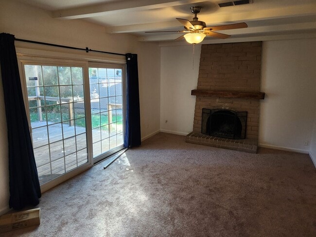 Building Photo - Adorable 4/2 With GREAT Backyard.  Gardene...