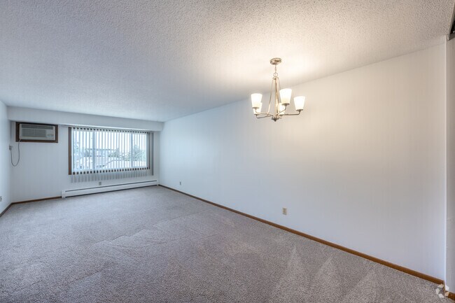 2 habitaciones, 1 baño - 847 pies cuadrados - B - Comedor y sala de estar - Surrey Gardens Apartments