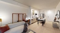 Located at 2 I St NE in Washington, DC, this contemporary apartment on the second floor offers a thoughtfully designed single-level layout that blends modern aesthetics with functional living. The open-concept floor plan seamlessly connects the kitchen, dining, and living areas, creating a bright and cohesive space throughout.

The kitchen is a standout feature, outfitted with sleek white upper cabinetry, light wood lower cabinets, quartz countertops, and a striking marble-style backsplash. Stainless steel appliances — including a range, over-the-range microwave, dishwasher, and refrigerator — complete the well-appointed space, which also benefits from recessed lighting.

The living area is anchored by large floor-to-ceiling sliding glass doors that open to an outdoor-facing view, flooding the room with natural light. Light wood-style flooring runs throughout the main living spaces, enhancing the airy, modern feel.

The bedroom is generously proportioned, featuring clean white walls, dual closets, and a calm, restful atmosphere. The bathroom continues the contemporary design language with a wood-toned vanity, white quartz countertop, backlit mirror, and black hardware accents. Light-toned flooring ties the space together with a clean, minimal finish.