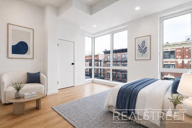 Building Photo - Sun-Filled Penthouse Duplex with Massive Private Terrace & Bonus Storage Room