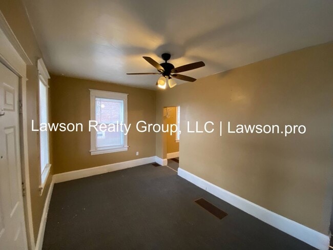Building Photo - Updated Three Bedroom with Flat Yard