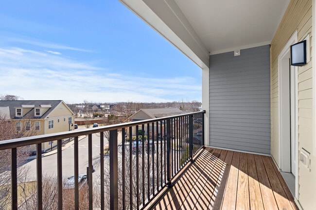 A cozy balcony perfect for every season - River Birch at Watertown