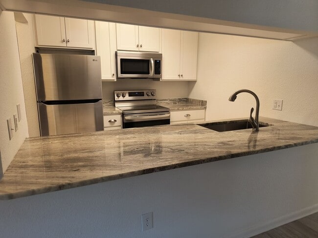 Building Photo - NEW LOWER PRICE  Wonderful 2 Bedroom 1.5 Bathroom condo