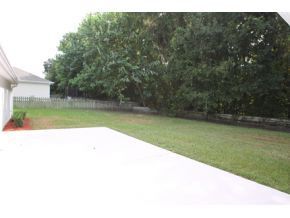 Open Back yard with tree line privacy and fenced in space - 3434 SW 10th Terrace