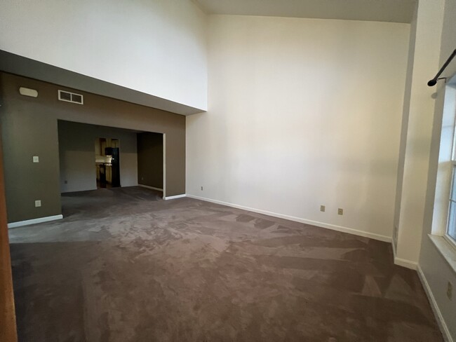 Spacious living room with accent wall - 106 Trotter Ln