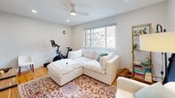 Located at 505 W Melrose St in Chicago's desirable Lakeview neighborhood, this one-bedroom, one-bathroom residence offers a thoughtfully organized single-level layout. The living room is a comfortable, light-filled space anchored by a ceiling fan, recessed lighting, and a large window that frames neighborhood views. Hardwood flooring runs throughout the main living areas, lending warmth and continuity to the space.

The kitchen flows into a dedicated dining area and is complemented by a pantry, providing ample storage and functionality. An entrance area and multiple closets — four in total — ensure excellent organizational capacity throughout the home.

The spacious bedroom features two sets of louvered bi-fold closet doors offering generous storage, hardwood floors, recessed lighting, and wide windows that bring in natural light and treetop views. A baseboard heating system runs along the exterior walls.

The bathroom is clean and bright, finished in white tile with a glass-sliding shower enclosure and modern fixtures. The overall aesthetic throughout the home is crisp and neutral, with white walls and light tones creating a cohesive, airy ambiance. This well-appointed residence delivers efficient, practical living in one of Chicago's most sought-after neighborhoods.