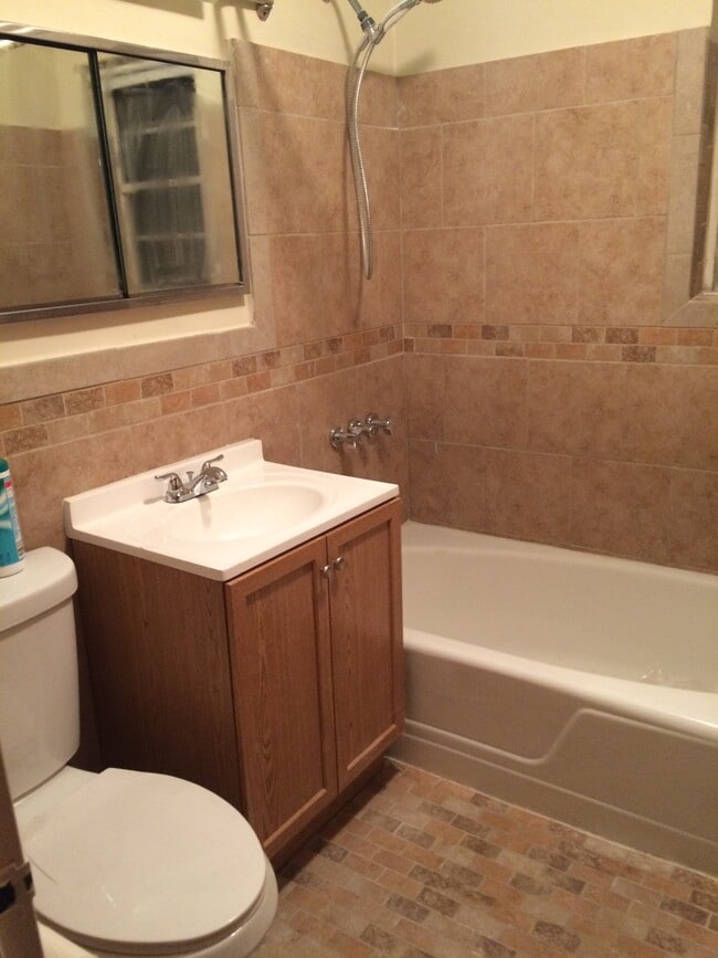 1st floor fully renovated bathroom - 210 East 238th Street