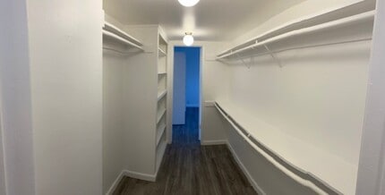 SHARED WALK IN CLOSET - Woodley Plaza