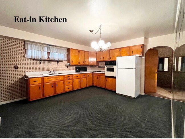 Retro eat-in kitchen (13*14) with beautiful pine cabinets. Electric oven and range top, refrigerator - 35 McGovern Blvd