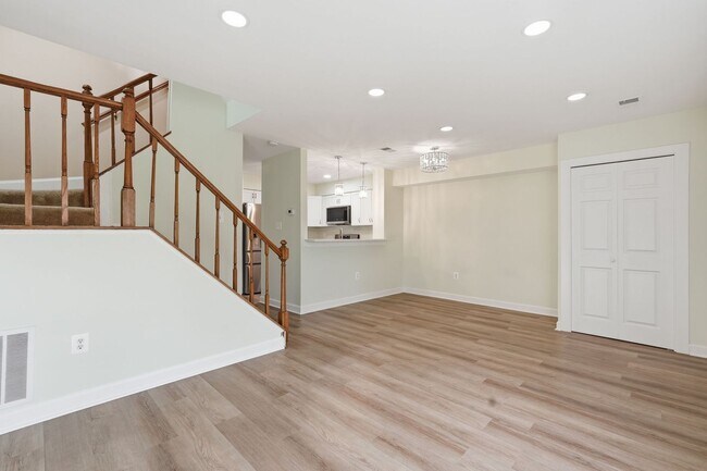 Building Photo - This exceptional home offers versatility, warmth, and elevated comfort across every level.