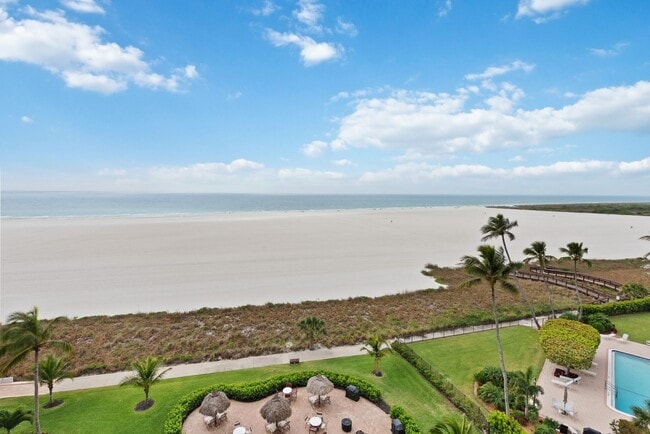 Building Photo - Get your Toes in the Sand at this Fully Furnished One Bedroom Beachfront Condo-Start October 1-2025