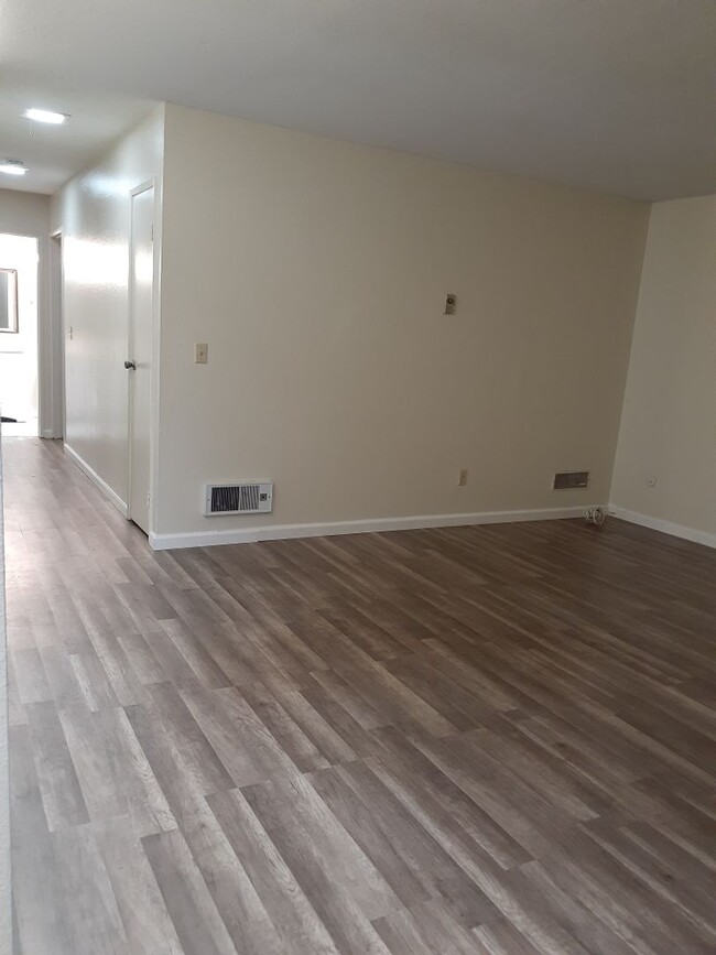Building Photo - 3 bedroom, 2 bath, ground floor unit, and private patio.