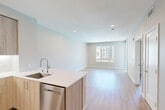 Located at 3580 Rambla Pl in Santa Clara, California, this thoughtfully designed one-bedroom, one-bathroom residence offers a clean, contemporary aesthetic throughout. Light wood-tone flooring flows seamlessly across the entire unit, complementing the neutral palette of soft gray and white walls.

The open-concept kitchen and living area form the heart of the home. The kitchen is outfitted with modern flat-front cabinetry in a warm natural wood finish, stainless steel appliances including a gas range, over-the-range microwave, French door refrigerator, and dishwasher, all anchored by a white quartz peninsula with an undermount sink. A white subway tile backsplash adds a crisp, polished accent. Recessed lighting brightens the space throughout.

The living area is bright and airy, with a large window framing views of the surrounding community courtyard and pool area. The bedroom continues the same light flooring and neutral tones, featuring a sizable window that fills the room with natural light and overlooks the outdoor amenity space. A dedicated closet provides convenient storage.

The bathroom is clean and functional, featuring a tub-shower combination, toilet, and wood-look flooring consistent with the rest of the unit. The overall design is modern and move-in ready, offering an efficient and well-appointed living environment in the heart of Silicon Valley.