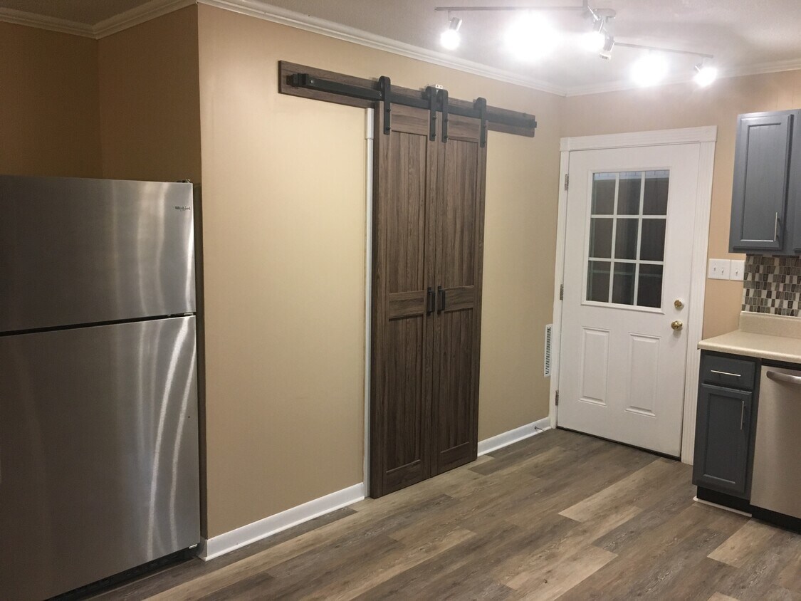 Laundry closet with custom barn-doors in kitchen - 510 Short St