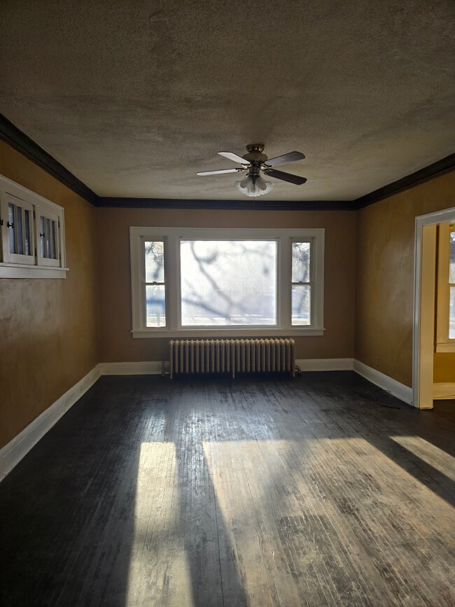 Open Living Room with Bay Window - 716 Elwood Ave N