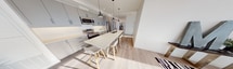 This contemporary 790 square foot apartment offers a perfect blend of style and functionality. The open-concept living area seamlessly integrates the kitchen, dining, and living spaces, creating an airy and spacious feel. The kitchen boasts sleek grey cabinetry, stainless steel appliances, and a large island with seating, ideal for casual dining or entertaining.

Both bedrooms are well-proportioned, with the primary bedroom measuring 140 square feet. Each room features ample closet space and large windows that flood the spaces with natural light. The two bathrooms are modern and pristine, with one featuring a glass-enclosed shower and the other a full-size bathtub.

Floor-to-ceiling windows in the living area and bedrooms offer breathtaking panoramic views of the city skyline, adding to the apartment's sense of luxury and spaciousness. The interior design is characterized by a neutral color palette, light wood flooring, and contemporary furnishings, creating a sophisticated urban oasis.

Additional features include recessed lighting throughout, a dedicated workspace, and carefully chosen decorative elements that add personality to the space. Located at 110 Fullarton in postal code 3003, this single-floor apartment combines comfort, style, and convenience in a highly desirable urban setting.