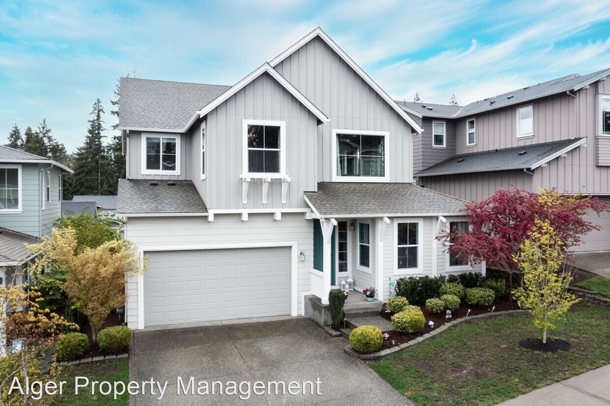 Foto principal - 4 br, 3 bath House - 2415 NE Boulderstone Ct.