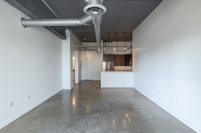 1BR, 1BA - 1,446SF - Living Room and Kitchen - The 1500 Condominium