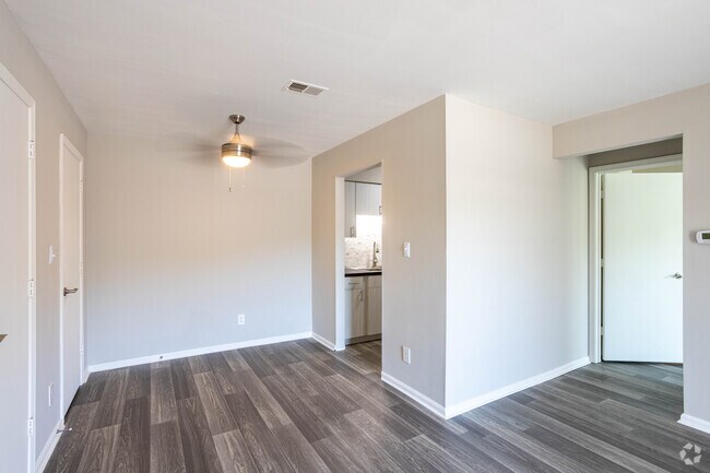 (R) RENOVATED THE FLOWERING DOGWOOD 1BR, 1BA - 700 SF - Living Room and Dining Area - Woodbridge Place Apartments