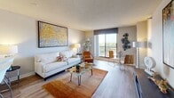 Located at 55 S Vail Ave in Arlington Heights, IL, this single-floor residence offers a thoughtfully designed layout that balances comfort and modern style throughout. The open-concept living and dining area is anchored by warm hardwood-style flooring and neutral-toned walls that create a bright, welcoming atmosphere. A large sliding glass door floods the living space with natural light and provides access to a balcony with expansive outdoor views of the surrounding area. The kitchen is well-equipped with rich dark wood cabinetry, dark granite countertops, stainless steel appliances including a range and built-in microwave, and a convenient breakfast bar for casual dining. The bedroom is a serene retreat featuring hardwood-style floors, a textured ceiling, and ample natural light from a large window with view. A dedicated walk-in closet provides generous storage, and a separate area for a desk or vanity adds functional versatility. The bathroom is cleanly finished with wood-style flooring, a full soaking tub with shower, and crisp white fixtures. Throughout the residence, a cohesive contemporary aesthetic is maintained, making this an informative and practical space for comfortable everyday living.