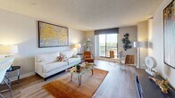 Located at 55 S Vail Ave in Arlington Heights, IL, this single-floor residence offers a thoughtfully designed layout that balances comfort and modern style throughout. The open-concept living and dining area is anchored by warm hardwood-style flooring and neutral-toned walls that create a bright, welcoming atmosphere. A large sliding glass door floods the living space with natural light and provides access to a balcony with expansive outdoor views of the surrounding area. The kitchen is well-equipped with rich dark wood cabinetry, dark granite countertops, stainless steel appliances including a range and built-in microwave, and a convenient breakfast bar for casual dining. The bedroom is a serene retreat featuring hardwood-style floors, a textured ceiling, and ample natural light from a large window with view. A dedicated walk-in closet provides generous storage, and a separate area for a desk or vanity adds functional versatility. The bathroom is cleanly finished with wood-style flooring, a full soaking tub with shower, and crisp white fixtures. Throughout the residence, a cohesive contemporary aesthetic is maintained, making this an informative and practical space for comfortable everyday living.