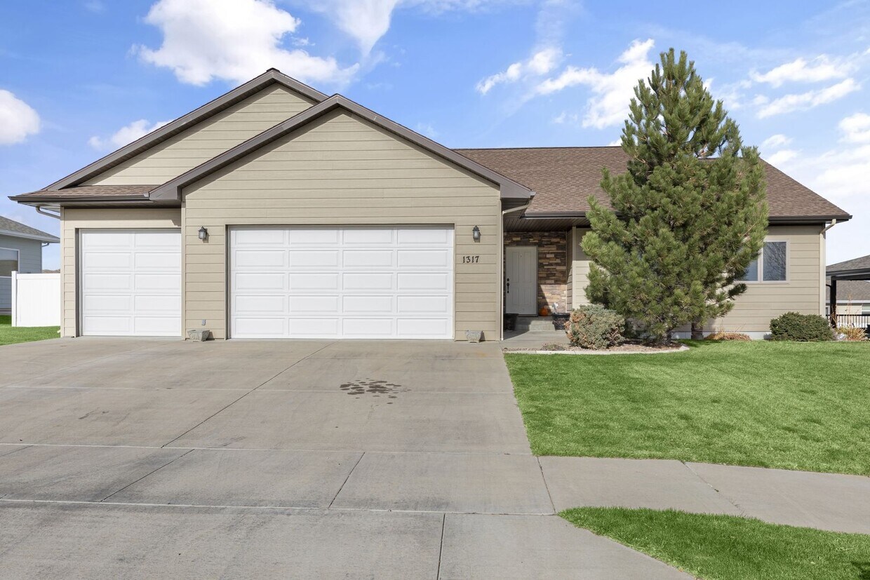 Primary Photo - Spacious 3-Car Garage, and Pet-Friendly Home