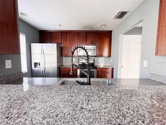 Foto del edificio - 5393 River Rock Rd