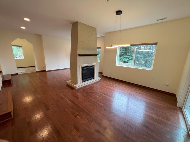 Living room/dining room with gas fireplace - 21078 NE 15th St