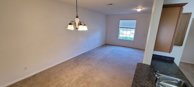 Building Photo - Spacious 3/3 townhome + attached 2-car gar...