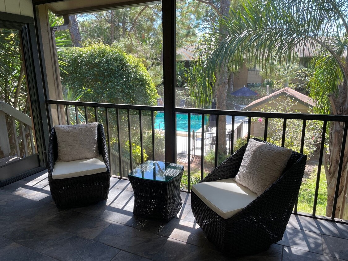 Patio with pool access - 1709 Pelican Cove Rd