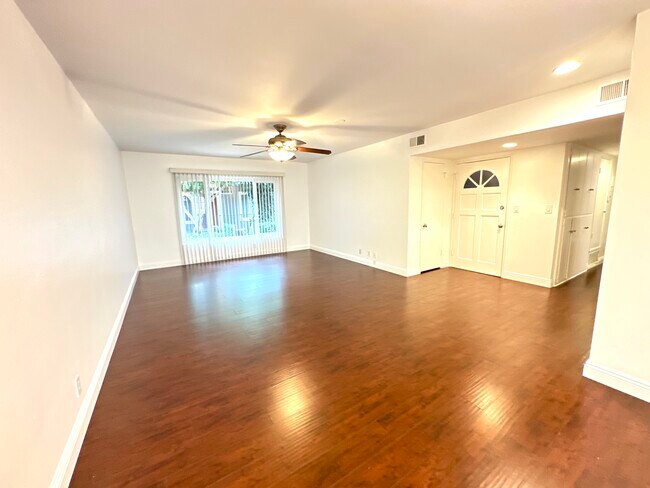 Dining area looking into living room and entrace - 10600 Eastborne Ave