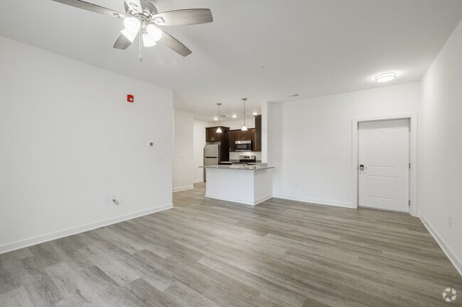3BR, 2BA - 1,372SF - Living Room and Kitchen - Abbey Place