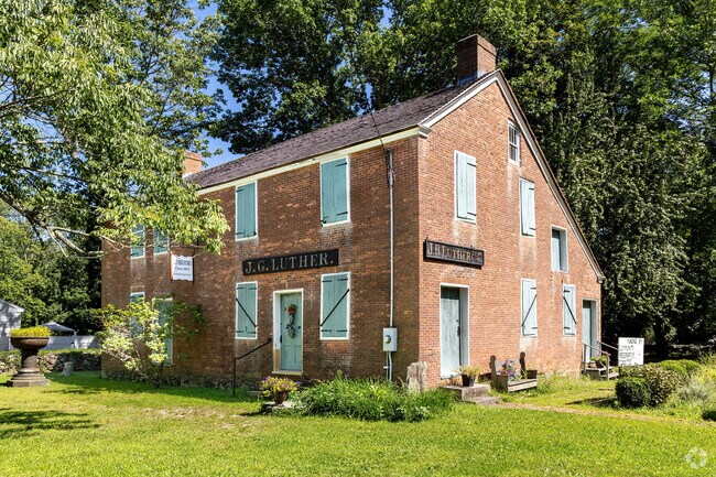 The Luther Store was built about 1813 and is a classic brick saltbox style in Luther Corner.