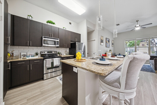 Modern Kitchen with Stainless Steel Appliances at Addison Keller Springs, Addison, TX - Addison Keller Springs