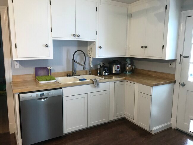 New Bosch dishwasher, farmhouse style sink, and butcher block countertops - 915 Montrose Ave