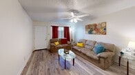 Located at 100 Belle Fontaine Dr in Lafayette, Louisiana, this single-story 2-bedroom, 2-bathroom residence offers a well-organized layout across a comfortable footprint. The living room serves as the heart of the home, featuring hardwood-style flooring, a textured ceiling, a ceiling fan with light fixture, and a classic fireplace with a mantel — an inviting focal point for the space. Natural light filters in through windows dressed with curtains, adding warmth to the neutral-toned walls.

The galley-style kitchen is efficiently designed with white cabinetry, ample counter space, a stainless steel sink, and full appliances, all set atop hardwood-style flooring. Adjacent to the kitchen, the dedicated dining room provides a defined space for meals, with the same consistent flooring continuing throughout.

The primary bedroom is a comfortable retreat with plush carpeting, a ceiling fan, a window with natural light, and a built-in closet. The second bedroom mirrors this layout with carpet, a ceiling fan, and closet storage. Both bathrooms are clean and functional, with one featuring a bathtub/shower combo, vanity, and wood-style flooring. Two closets provide additional storage throughout the unit.