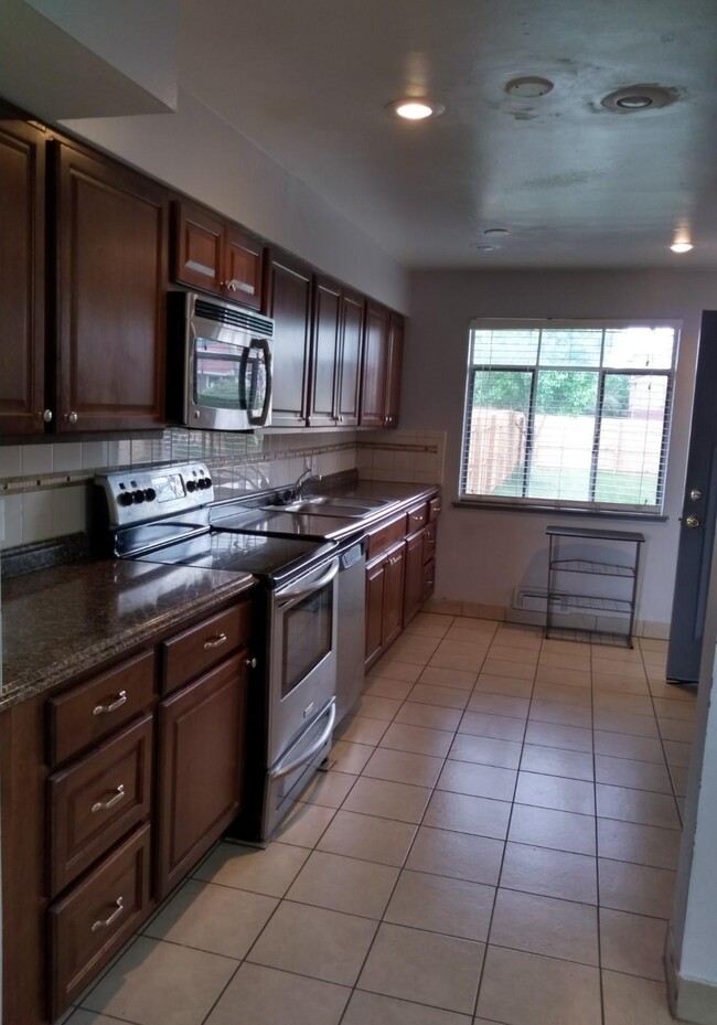 Kitchen with galley - 3692 N Monaco Pkwy