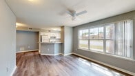 Located at 532 Park Tree Terrace in Orlando, FL, this single-floor, 3-bedroom, 2-bathroom home offers a practical and comfortable layout with consistent wood-look flooring and a neutral gray color palette throughout. The open-concept living and dining area is bright and airy, featuring a ceiling fan, a large window with outdoor views, and a seamless flow into the kitchen. The kitchen is equipped with white shaker-style cabinetry, a gas range, a full-size refrigerator, a double-basin sink, and laminate countertops. A peninsula counter provides additional workspace and serves as a natural divide between the kitchen and living area. Three bedrooms are well-proportioned, each finished with the same wood-look flooring and soft gray walls. The primary bedroom includes a ceiling fan and is served by closet space, while the additional bedrooms feature windows that bring in natural light. Two full bathrooms include white vanities with clean countertops and tiled shower-tub combinations. Two hallways and two closets provide practical storage and circulation throughout the home. The overall design is clean, functional, and move-in ready, well-suited for everyday living in a convenient Orlando location.