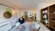 Located at 4800 Berwyn House Rd in College Park, MD, this 2-bedroom, 1-bathroom unit offers a thoughtfully designed single-floor layout that maximizes functionality and comfort. The open-concept living area is bright and welcoming, featuring large windows that invite natural light and views of the outdoors. A built-in bookshelf with warm wood tones adds character, while light-toned flooring runs throughout, creating a cohesive and modern aesthetic.

The kitchen is well-appointed with a U-shaped layout, stainless steel appliances including a gas range, two-tone cabinetry combining warm wood lower cabinets and light upper cabinets, a gray tile backsplash, and stone countertops — offering both style and practicality.

The primary bedroom is generously sized, featuring dual windows that provide ample natural light, a spacious closet with clean white bifold doors, and wood-look flooring. The second bedroom is equally well-lit and comfortable. Both rooms feature a calm, neutral palette conducive to rest.

The bathroom showcases floor-to-ceiling vertical tile, a glass-enclosed shower, and polished chrome fixtures, delivering a clean and contemporary finish. Throughout the unit, clean lines, warm wood accents, and a neutral color palette create a cohesive, modern living environment.