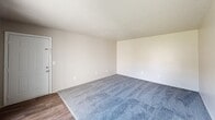 Located at 400 Greenlawn Dr in Columbia, SC, this single-floor, 4-bedroom, 2-bathroom home offers a practical and functional layout designed to maximize living space. The generously sized primary bedroom features plush carpeting, a textured ceiling, a window with outdoor views, and convenient access to a dedicated closet. The three additional bedrooms are similarly appointed with soft carpet flooring, neutral walls, and windows that bring in natural light and views of the surrounding greenery. Each bedroom offers comfortable proportions suitable for a variety of uses. The home includes two kitchen areas, each featuring dark speckled countertops, white cabinetry, and durable wood-style flooring that adds a warm, cohesive feel. The living area transitions seamlessly between carpet and hardwood-style flooring and is anchored by a ceiling fan and a sliding glass door that opens to a private balcony overlooking a landscaped outdoor setting. Two full bathrooms serve the home — one featuring a full tub/shower combo with chrome fixtures, and the other a clean, white walk-in shower unit. A hallway connects the rooms efficiently, and two closets provide added storage throughout. Textured ceilings are consistent throughout the home, contributing to its classic residential character.