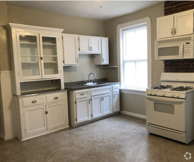 Large eat in kitchen. Previous resident fit a table with 6 chairs. Paint is updated to white. - 5313 Magnolia Ave