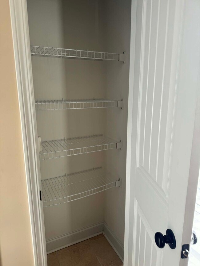 Downstairs half bath linen closet - 232 High Meadows Cir