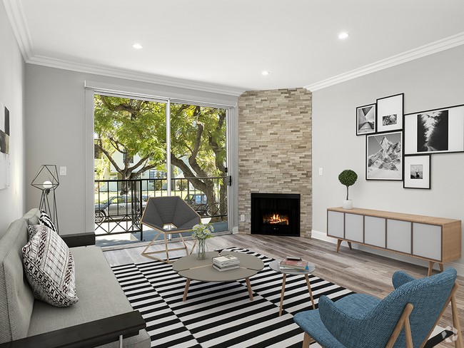 Hardwood floored living room with balcony access and stone walled fireplace. - Clarington Court