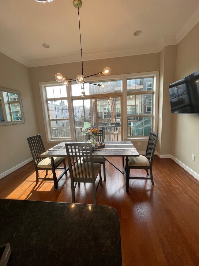 Separate dining area with balcony access and tv hook-up - 127 W Fort Ave